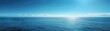 © kornc - The ocean is calm and blue, with a clear sky above