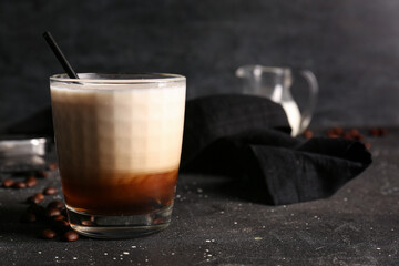 Wall Mural - Glass of White Russian cocktail and coffee beans on black background