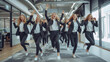 © EnGbarr - group of business women in suits dancing and cheering