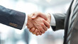 © Your Hand Please - professional handshake between businessmen, symbolizing trust, agreement, partnership, and successful collaboration. The image captures a formal, positive interaction in a business setting