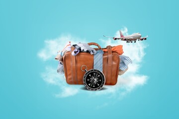 Wall Mural - Tavel luggage with set of staff and white clouds