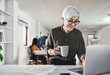 © A. Frank/peopleimages.com - Mature, businesswoman and typing on laptop in office for editing blog post, online article or website review with coffee. Copywriting agency, employee and technology in coworking space with documents