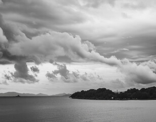 Wall Mural - Beautiful cloudy sky in a black and white photograph on a rainy day