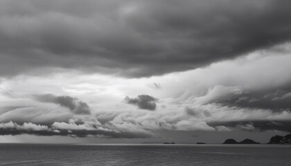 Wall Mural - Beautiful cloudy sky in a black and white photograph on a rainy day