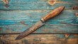 © Udomner - Vintage old knife with rust on the blade and a weathered wooden handle , antique, ancient, kitchenware, utensil, sharp, aged