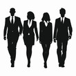 © Supardi - Silhouettes of four business people walking together.