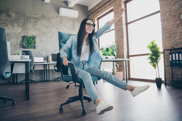 Poster - Full body photo of young woman ride armchair superhero wear denim clothes executive business leader work comfort beautiful office interior