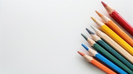 Sticker - Collection of 12 small colorful wooden pencils on a white background with room for text