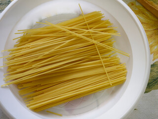 detail of raw spaghetti in a dish