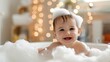 © sknab - Smiling infant enjoying bath time with bubbles and warm light