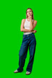 © fotofabrika - Woman Thinking In White Tank Top and Jeans Against Green Screen