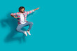 © deagreez - Photo of funny sportsman young man wear stylish striped clothes fight look empty space isolated on cyan color background