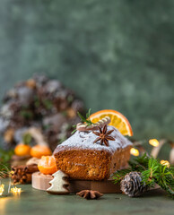 Wall Mural - Traditional Christmas fruit loaf cake, pudding with dried fruits and nuts on stone concrete table background with festive holiday decoration. Christmas Dessert.