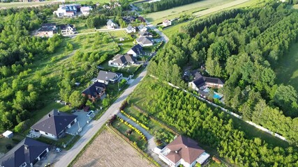 Poster - Suburban homes surrounded by lush greenery from above