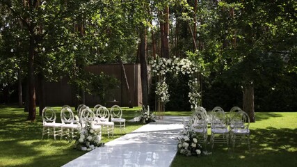 Canvas Print - a beautiful arch for a wedding ceremony in a park with chairs