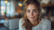 © fotofabrika - Young Woman Smiling In Cozy Indoor Setting