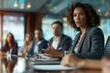 © siripimon2525 - Close-up of a woman leading a team meeting, confident and inspiring, modern boardroom setting, Portrait half-body, hyper-realistic, high detail, photorealistic, American professionals