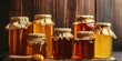 © marimalina - different types of honey, featuring jars or pots of honey in various colors and textures