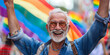 © Sergey - happy senior american gay man  with rainbow flags, candid LGBTQ+