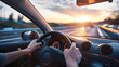 © Daniel - Driver's view inside a car with hands on the steering wheel, driving on a highway at sunset. 
