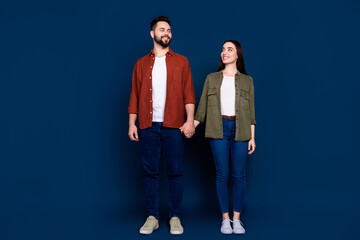 Sticker - Photo of cheerful nice young married couple wife husband wear stylish clothes isolated on dark blue color background