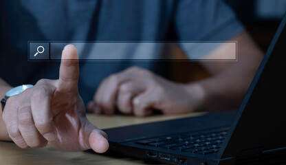 Wall Mural - information search concept, search engine optimization technology human hands using a laptop to sear