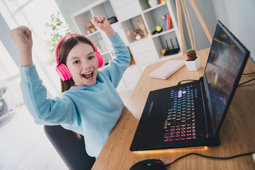 Canvas Print - Photo of cheerful cute glad nice girl addicted gamer rejoice win online computer game modern technology indoors