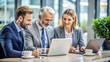 © Afroza - Businesspeople having a discussion using laptop