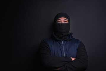 man, portrait and mask of robber in studio, burglar and criminal or black background for thief. male