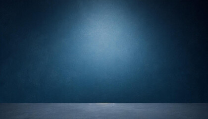Poster - Empty Blue Studio Room with Concrete Floor, Textured Blue Wall, and Spotlight Creating Dramatic Lighting Effect, Suitable for Backgrounds, Presentations, and Design Layouts