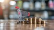 © Jack - Increasing trend graph of sale volume with bigger shopping trolley cart on coins stacking for online sale business and ecommerce growth concept.