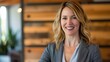 © EddieSnapix - Smiling blonde Businesswoman in Stylish Office Setting
