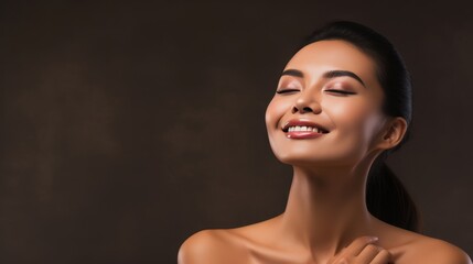 Wall Mural - Asian woman touching healthy skin, cosmetics concept, model with copy space on clean background