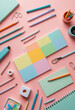 © jarntag - Creative flat lay of office supplies on a pastel background.