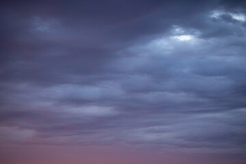 Sunrise sky above a city. Incredible natural colors. Red, orange, purple, dark blue. Heaven.