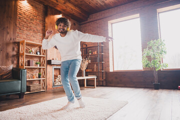 Wall Mural - Photo of attractive funny guy wear white sweatshirt earphones dancing enjoying weekend indoors room home house