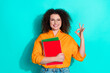 © deagreez - Photo of satisfied nice woman with wavy hair dressed shirt in glasses hold book showing okey approve isolated on teal color background