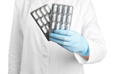 Canvas Print - Doctor holding blisters with antibiotic pills on white background, closeup