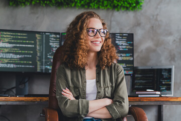 Photo of dreamy confident pretty woman software developer sitting armchair comfortable office workspace workstation indoors