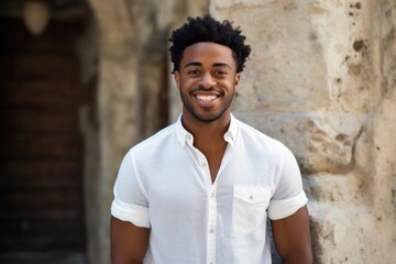 Sticker - Portrait of a happy afro-american man in his 20s sporting a versatile denim shirt isolated on backdrop of ancient ruins