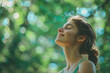© PRASANNAPIX - athletic girl on the right breathing a sigh of relief and smiling. Forest green and easy blue background