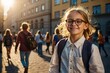 © Ольга Симонова - Portrait of a happy Caucasian schoolgirl child with glasses On the street of the city in the sunlight. Back to school, correction of pupil eyesight.