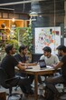 © Andrii Zastrozhnov - A professional team collaborates in an office meeting, utilizing technology for effective brainstorming.