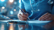 © Atomic62 Studio - Medical professional writing on a document at a desk with a stethoscope in a healthcare setting, representing healthcare and documentation.