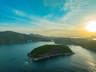 Aerial view Man island is in front of Phrom Thep. The sky is filled with blue clouds in the morning.Blue clouds roll over the sea.Tourist attractions that are gathered together near Man isle