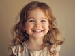 © Withun - A cheerful young girl with curly hair smiles brightly, radiating joy and innocence in a simple, warm setting.
