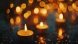 © QAISAR - Candles in the dark with soft focus and bokeh memorial hope