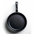 © LUPACACO - Black Cast Iron Skillet Against White Background