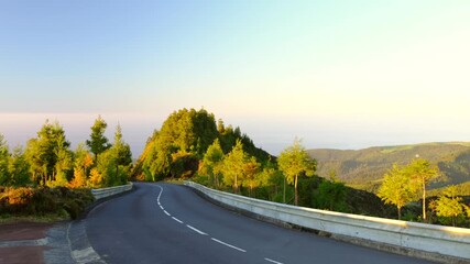 Wall Mural - Empty mountain asphalt road at sunset in Lagoa do Fogo on the island of Sao Miguel, Azores