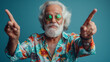 © kosoff - Portrait of a joyful elderly grandfather tourist in a Hawaiian shirt and with a beard on a colored background. Vacation at sea, prosperous old age and travel